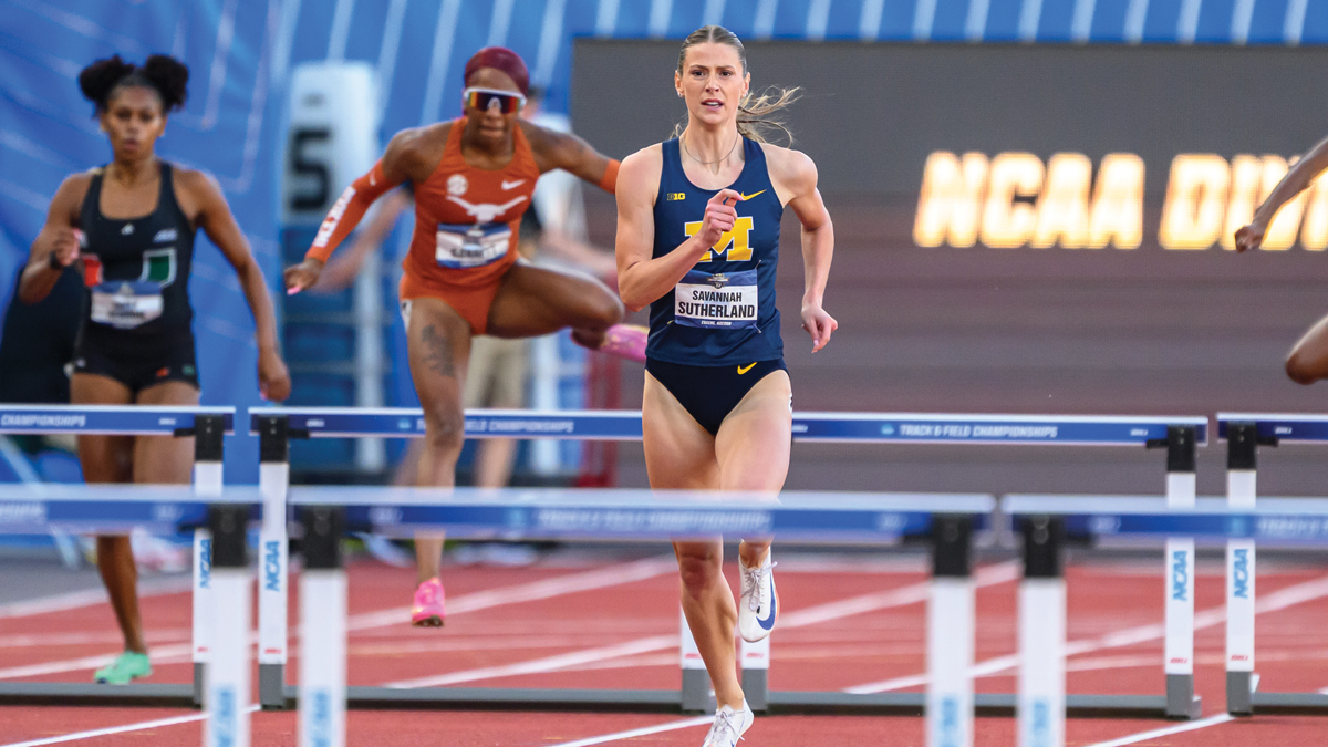 Savannah Sutherland running hurdles in a race